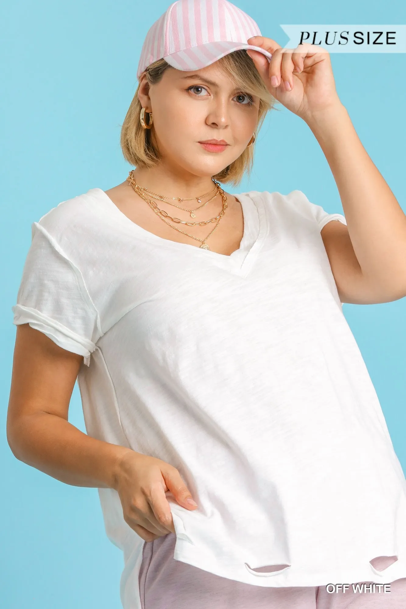 Gathered Short Sleeve V-Neck Knit Top with a Distressed Hem and Side Slits